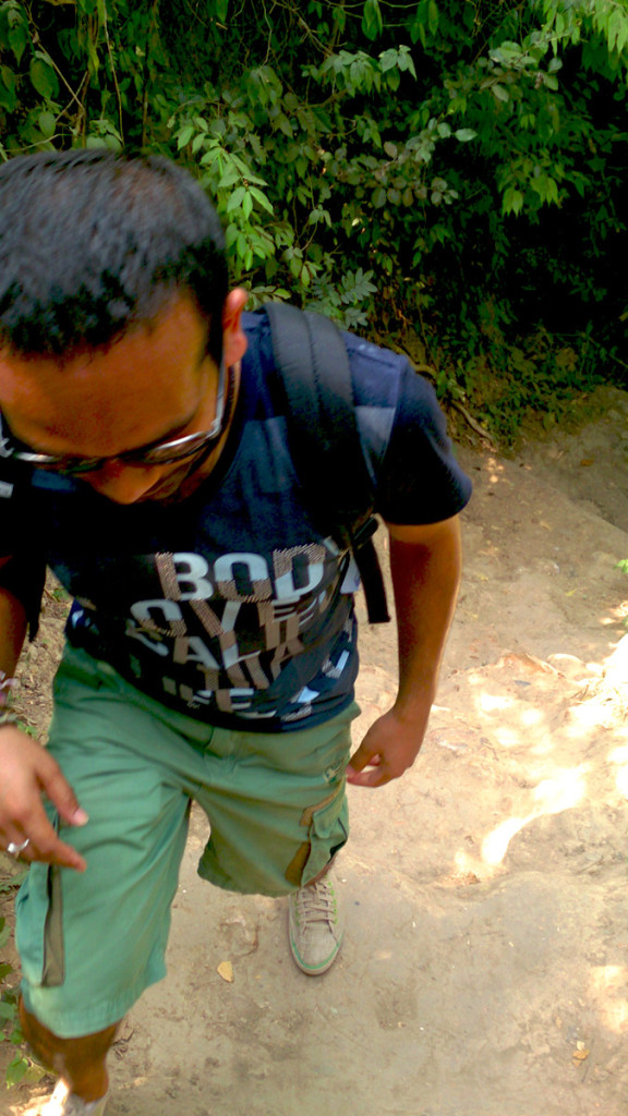 Climbing toward the top of the Erawan Waterfalls